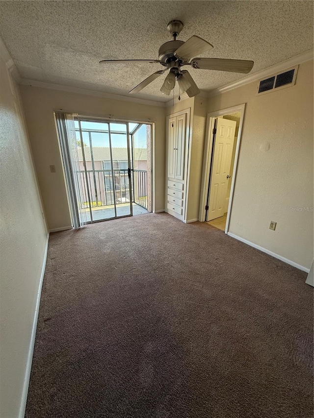 128 Water Front Way Unit 300, Altamonte Springs, FL 32701 - empty room featuring ceiling fan, a textured ceiling, visible vents, carpet floors, and ornamental molding