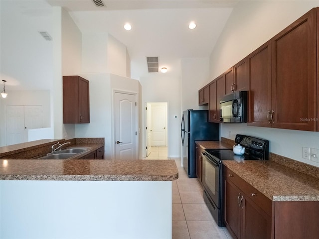 2907 Southern Pines Loop, Clermont, FL 34711 - kitchen with a sink, light tile patterned flooring, black appliances, and visible vents
