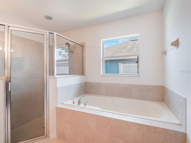 2907 Southern Pines Loop, Clermont, FL 34711 - full bathroom with a wealth of natural light, a shower stall, and a bath