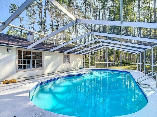 21940 Dupree Dr, Land O Lakes, FL 34639 - pool featuring glass enclosure and a patio area