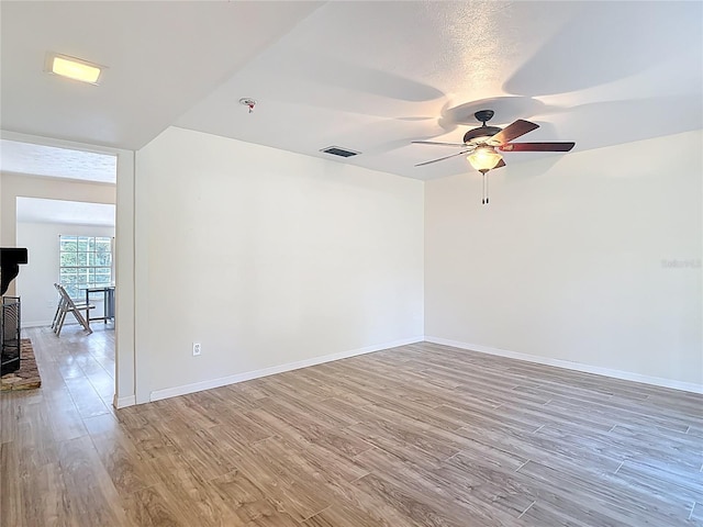 21940 Dupree Dr, Land O Lakes, FL 34639 - spare room featuring baseboards, ceiling fan, visible vents, and wood finished floors