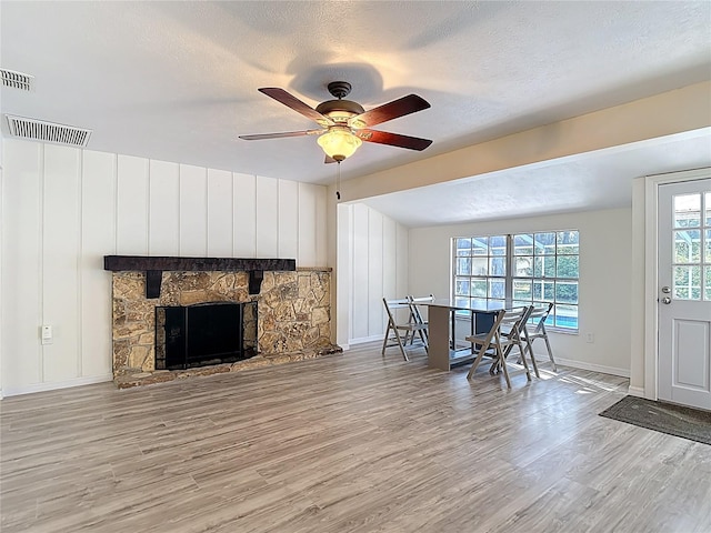21940 Dupree Dr, Land O Lakes, FL 34639 - living room with baseboards, ceiling fan, wood finished floors, and visible vents