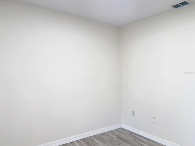 21940 Dupree Dr, Land O Lakes, FL 34639 - empty room featuring visible vents, baseboards, and wood finished floors