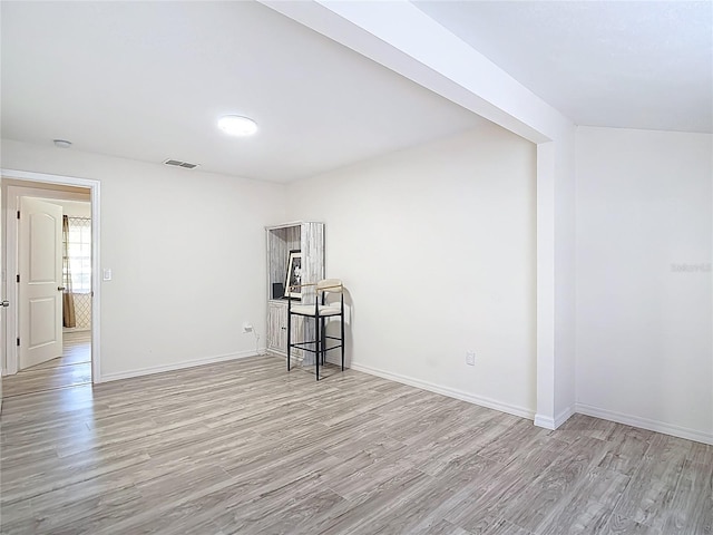 21940 Dupree Dr, Land O Lakes, FL 34639 - unfurnished room featuring visible vents, baseboards, and wood finished floors