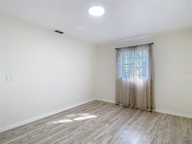 21940 Dupree Dr, Land O Lakes, FL 34639 - empty room featuring baseboards, visible vents, and wood finished floors