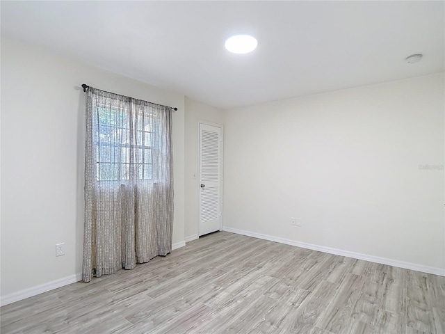 21940 Dupree Dr, Land O Lakes, FL 34639 - spare room with baseboards and light wood-style flooring