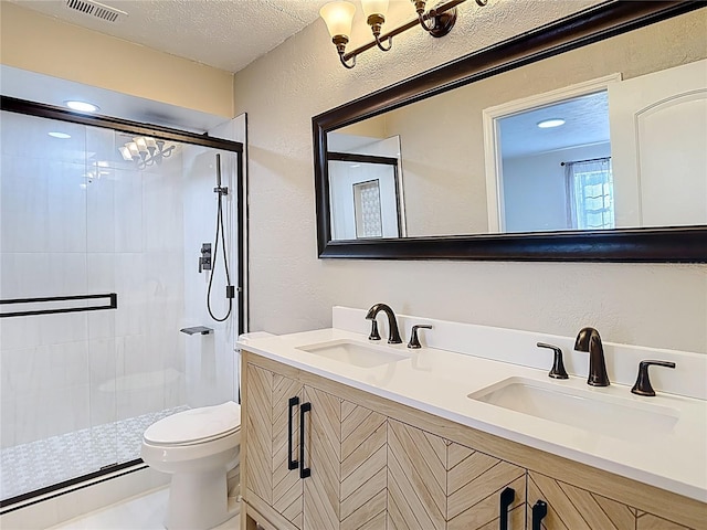 21940 Dupree Dr, Land O Lakes, FL 34639 - full bath with toilet, a textured wall, a sink, and a stall shower