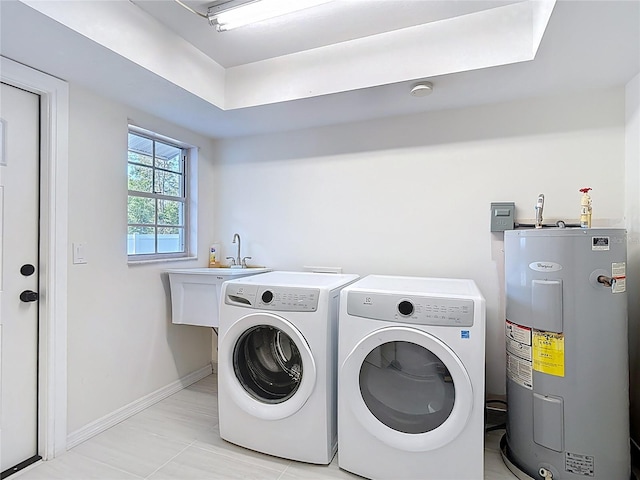 21940 Dupree Dr, Land O Lakes, FL 34639 - clothes washing area with electric water heater, laundry area, light tile patterned floors, baseboards, and washer and dryer