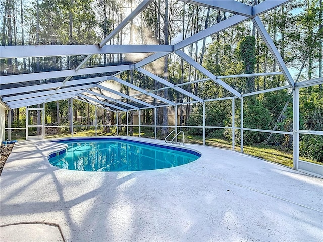 21940 Dupree Dr, Land O Lakes, FL 34639 - pool featuring glass enclosure and a patio
