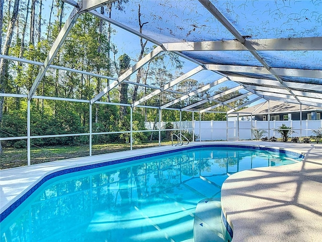 21940 Dupree Dr, Land O Lakes, FL 34639 - view of pool with a fenced in pool, fence, glass enclosure, and a patio area