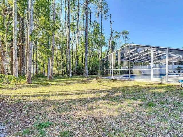 21940 Dupree Dr, Land O Lakes, FL 34639 - view of yard with glass enclosure and an outdoor pool