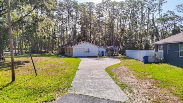 21940 Dupree Dr, Land O Lakes, FL 34639 - exterior space with fence, driveway, and a garage