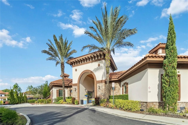4201 Oakview Dr, Davenport, FL 33837 - exterior space with a tile roof, stone siding, and stucco siding