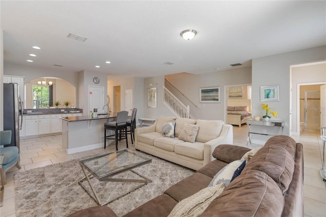 4201 Oakview Dr, Davenport, FL 33837 - living area with visible vents, recessed lighting, light tile patterned floors, and stairway