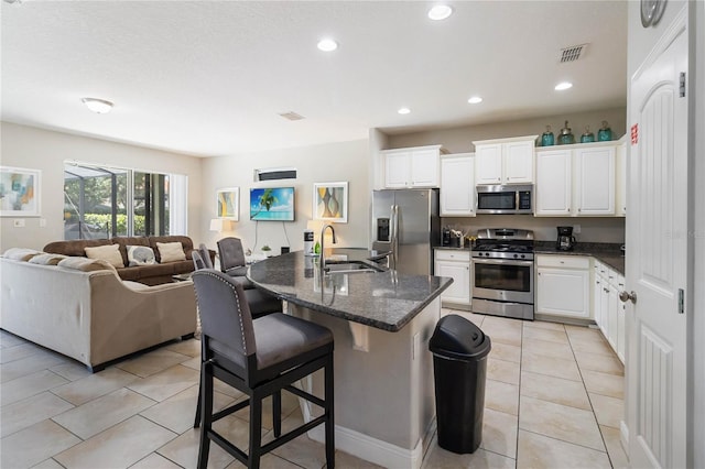 4201 Oakview Dr, Davenport, FL 33837 - kitchen featuring a sink, light tile patterned floors, stainless steel appliances, and open floor plan