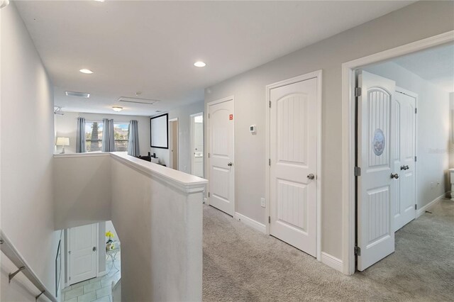 4201 Oakview Dr, Davenport, FL 33837 - hallway featuring visible vents, light carpet, baseboards, recessed lighting, and an upstairs landing