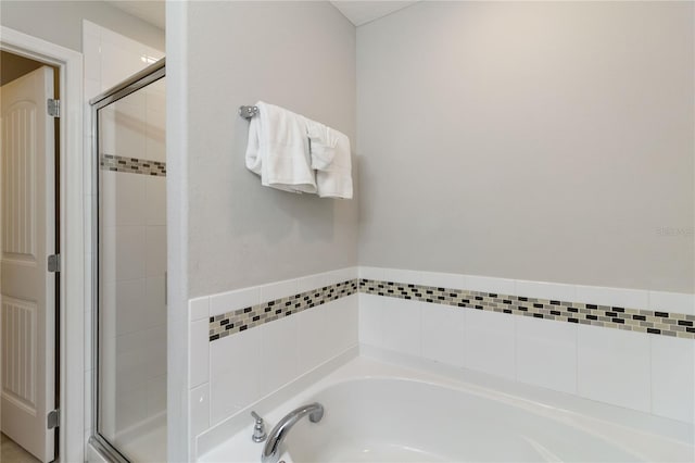 4201 Oakview Dr, Davenport, FL 33837 - bathroom with a garden tub and a shower stall