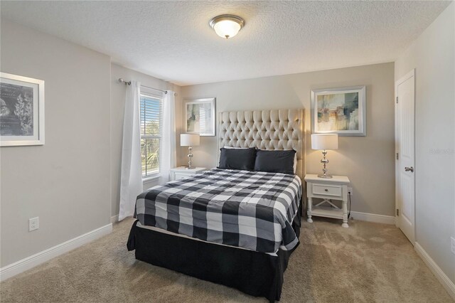 4201 Oakview Dr, Davenport, FL 33837 - carpeted bedroom featuring baseboards and a textured ceiling
