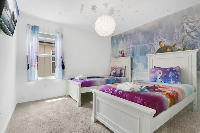 bedroom featuring carpet and baseboards
