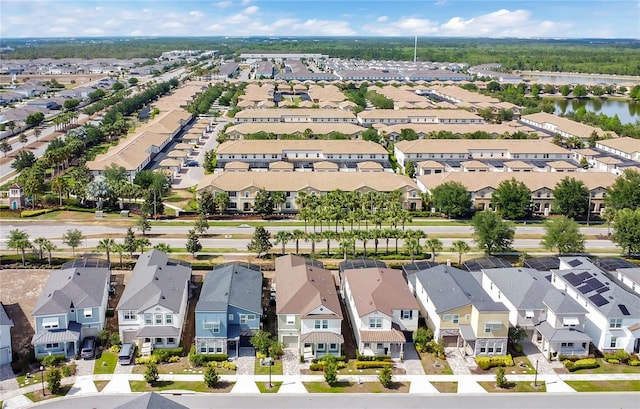 bird's eye view with a water view and a residential view