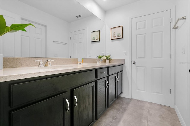 8951 Amelia Downs Trl, Kissimmee, FL 34747 - full bathroom featuring double vanity and tile patterned floors