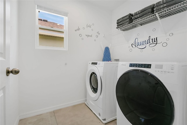 8951 Amelia Downs Trl, Kissimmee, FL 34747 - laundry area with independent washer and dryer and baseboards