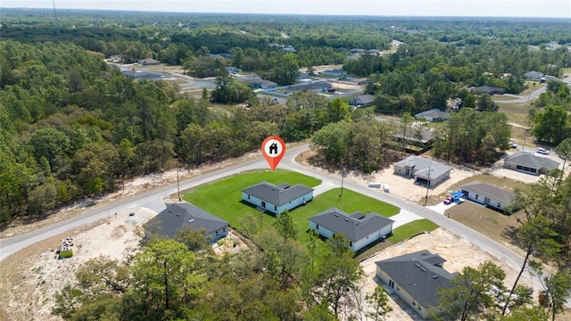 6257 SW 153 Rd Ln, Ocala, FL 34473 - drone / aerial view featuring a view of trees