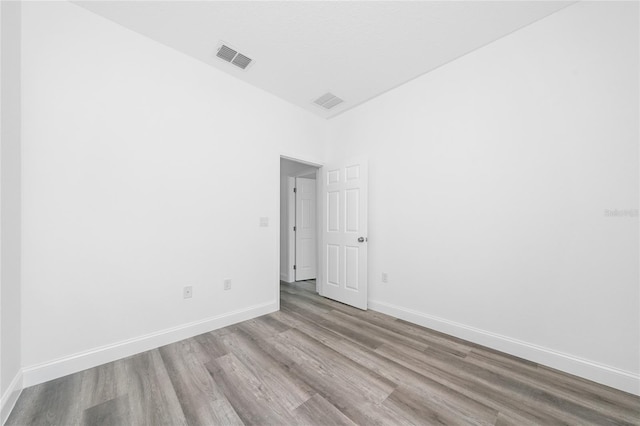 6257 SW 153 Rd Ln, Ocala, FL 34473 - spare room featuring baseboards, wood finished floors, and visible vents
