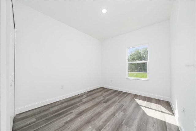 6257 SW 153 Rd Ln, Ocala, FL 34473 - spare room with baseboards, wood finished floors, and recessed lighting