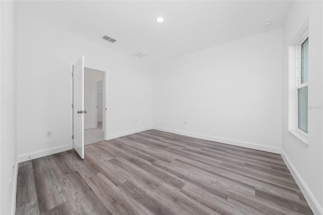6257 SW 153 Rd Ln, Ocala, FL 34473 - spare room with baseboards, wood finished floors, visible vents, and recessed lighting