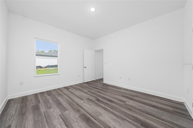 6257 SW 153 Rd Ln, Ocala, FL 34473 - empty room with recessed lighting, baseboards, and dark wood-style flooring