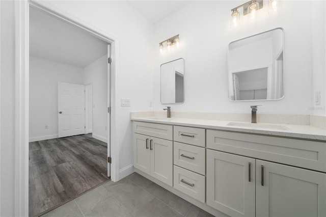 6257 SW 153 Rd Ln, Ocala, FL 34473 - bathroom with baseboards, a sink, and double vanity