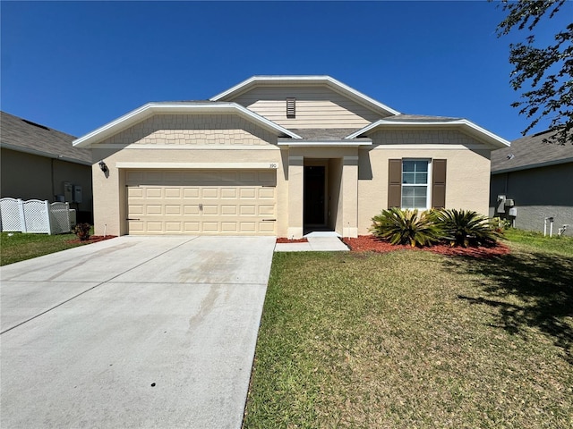 single story home with an attached garage, driveway, a front yard, and stucco siding