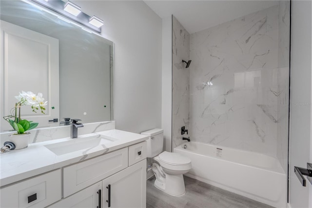 59 W 10th St, Apopka, FL 32703 - full bath with vanity, wood finished floors, and tub / shower combination