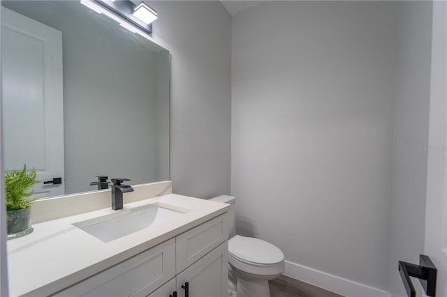 59 W 10th St, Apopka, FL 32703 - half bathroom with vanity and wood finished floors