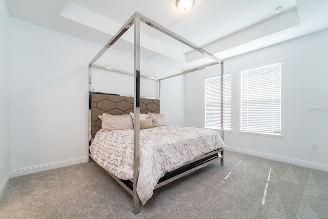 bedroom with baseboards and carpet flooring