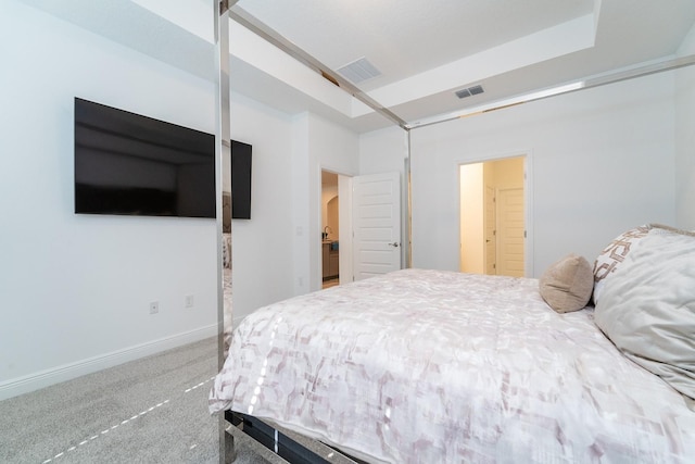 bedroom featuring baseboards, arched walkways, visible vents, and carpet