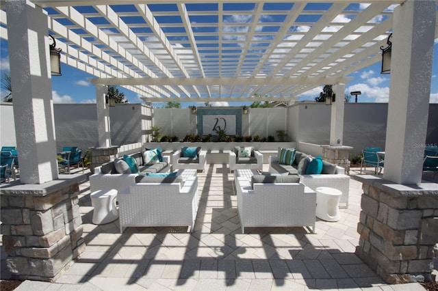 view of patio with a fenced backyard, a pergola, and an outdoor living space