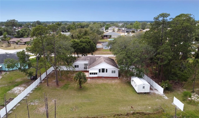 birds eye view of property with a residential view