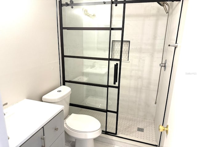 604 Kenwick Cir Unit 105, Casselberry, FL 32707 - bathroom featuring a shower stall, toilet, and vanity