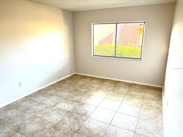 604 Kenwick Cir Unit 105, Casselberry, FL 32707 - empty room with a textured ceiling and baseboards