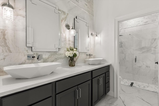 16500 Magnolia Terrace Blvd, Montverde, FL 34756 - full bath with marble finish floors, double vanity, a stall shower, and toilet