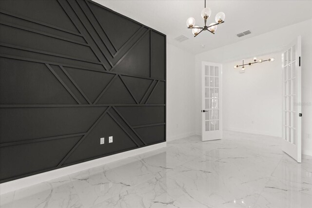 16500 Magnolia Terrace Blvd, Montverde, FL 34756 - unfurnished room with a chandelier, french doors, baseboards, and marble finish floors