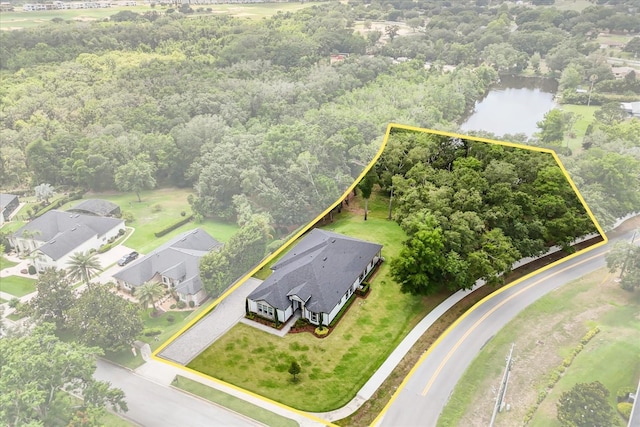 16500 Magnolia Terrace Blvd, Montverde, FL 34756 - aerial perspective of suburban area with property boundaries highlighted, a nearby body of water, and a heavily wooded area