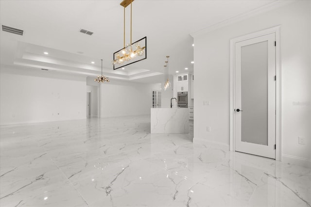 16500 Magnolia Terrace Blvd, Montverde, FL 34756 - unfurnished living room featuring a chandelier, recessed lighting, a tray ceiling, light marble finish floors, and baseboards