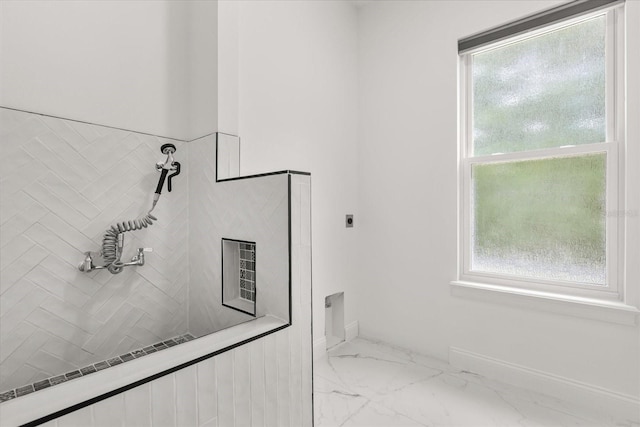 16500 Magnolia Terrace Blvd, Montverde, FL 34756 - full bath with marble finish flooring, plenty of natural light, a tile shower, and baseboards