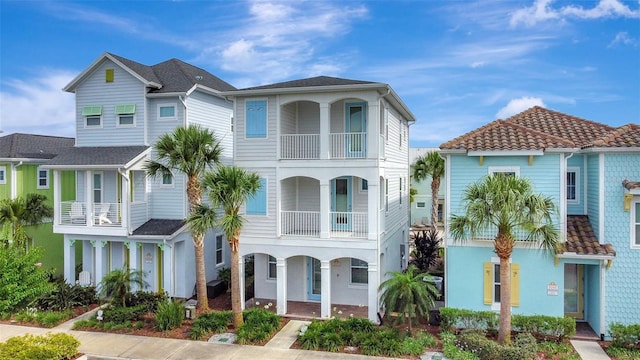 8044 Lost Shaker Ln, Kissimmee, FL 34747 - view of front of home featuring a balcony and a porch