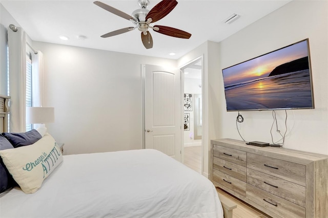 8044 Lost Shaker Ln, Kissimmee, FL 34747 - bedroom with light wood finished floors, a ceiling fan, ensuite bathroom, and recessed lighting
