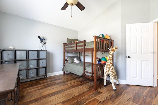 bedroom featuring ceiling fan, baseboards, vaulted ceiling, and wood finished floors