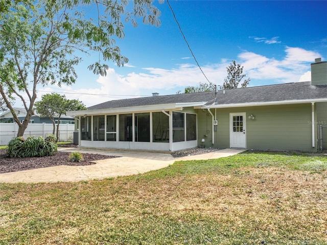 236 N Ranger Blvd, Winter Park, FL 32792 - back of property with a sunroom, a chimney, and a shingled roof